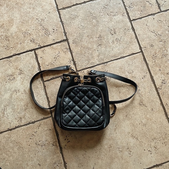 Free People Handbags - Free People black and gold faux leather backpack